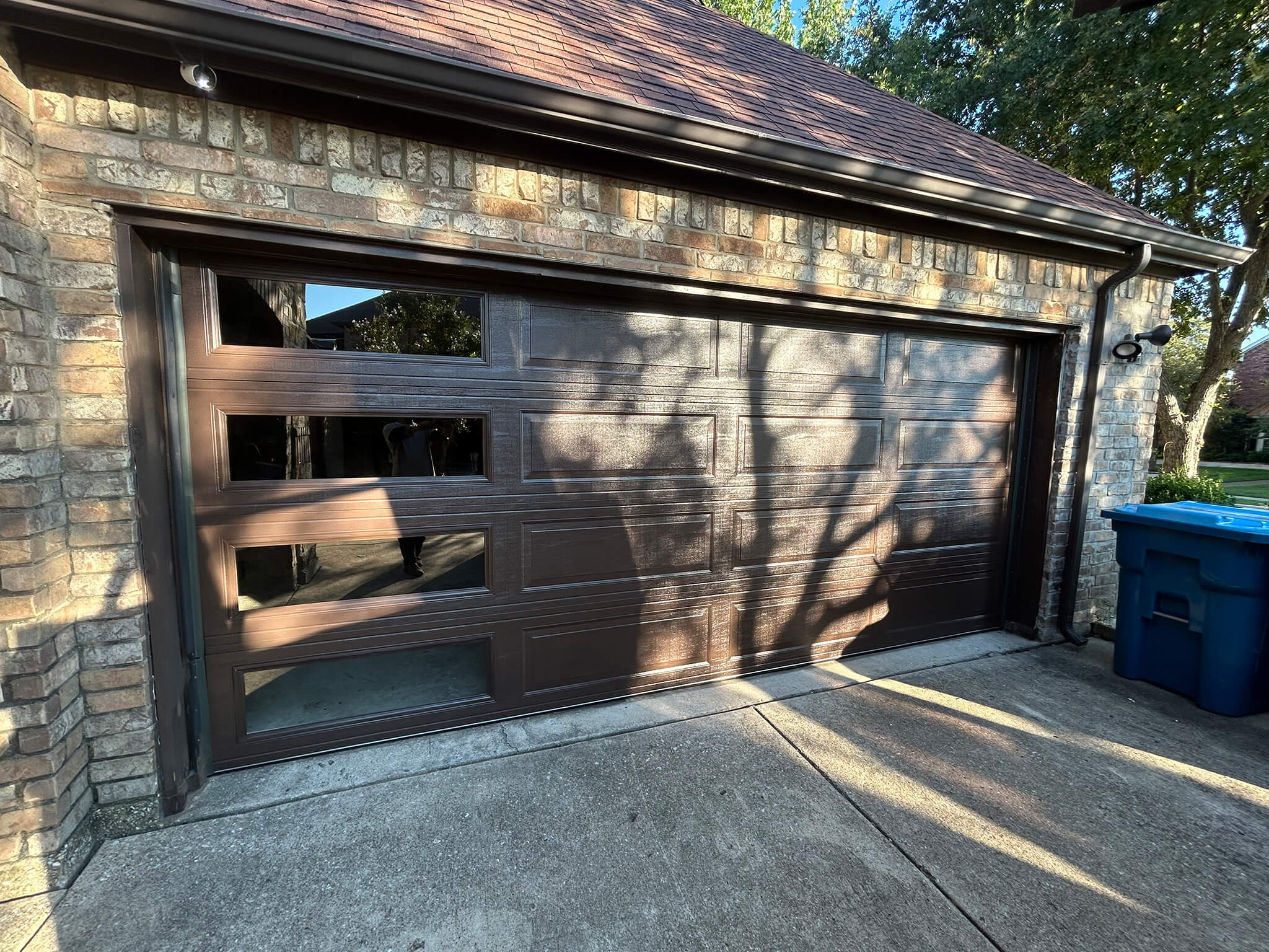 Wanda technician repairing a garage door in Dallas
